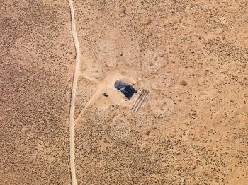 Royalty Free Photo of an Aerial of a House in a Remote Area of Arizona Desert