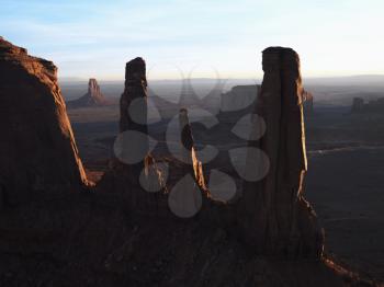 Royalty Free Photo of Three Sisters Rock formations in Monument Valley