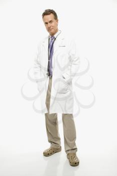 Royalty Free Photo of a Male Doctor With His Hands in His Lab Coat Pockets