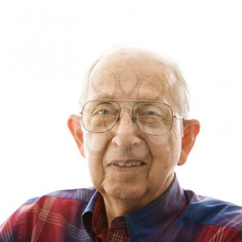 Royalty Free Photo of a Portrait of a Smiling Elderly Man in a Plaid Shirt and Glasses
