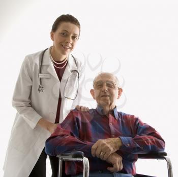 Royalty Free Photo of a Doctor With Hands on an Elderly Man's Shoulder in a Wheelchair
