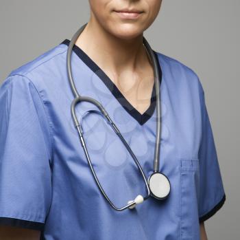 Royalty Free Photo of a Close-up View of a Female Doctor Wearing Scrubs With a Stethoscope Around Her Neck