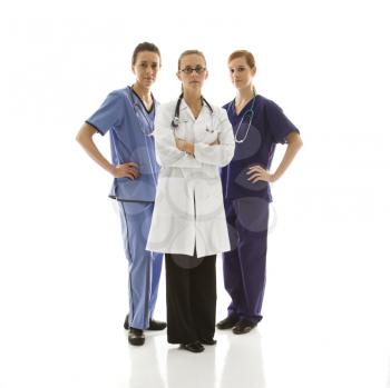 Royalty Free Photo of Female Health Care Workers in Uniforms Standing Against a White Background