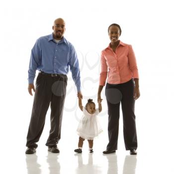Royalty Free Photo of a Family Standing Smiling