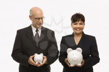 Royalty Free Photo of a Middle-Aged Businessman and Businesswoman Holding Piggybanks