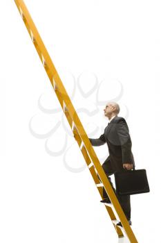 Caucasian middle-aged businessman climbing ladder carrying briefcase.