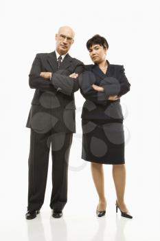 Royalty Free Photo of Smiling Businessman and Businesswoman Standing With Arms Crossed