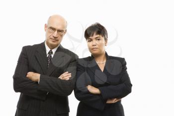Royalty Free Photo of a Businessman and Businesswoman Standing With Arms Crossed