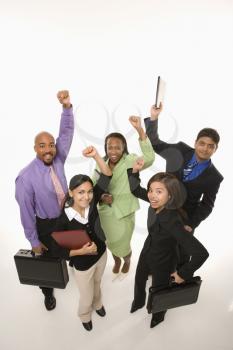 Portrait of multi-ethnic business group standing holding briefcases and cheering.