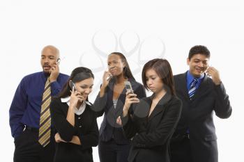Royalty Free Photo of a Group of Businesspeople Standing Talking on Their Cellphones