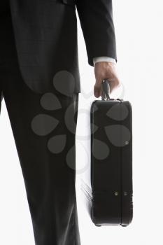 Royalty Free Photo of a Close-up of a Man's Hand Holding a Briefcase
