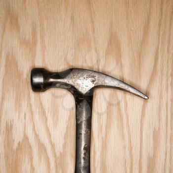 Royalty Free Photo of a Metal Hammer on Wood