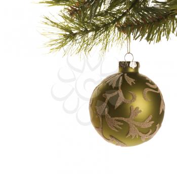 Royalty Free Photo of Still Life of a Gold Christmas Ornament Hanging From a Pine Branch