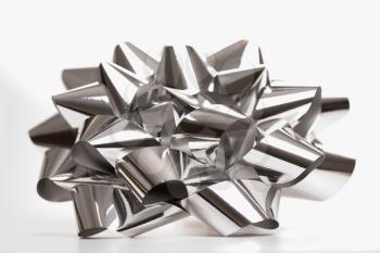 Royalty Free Photo of a Still Life of a Big Shiny Silver Christmas Bow