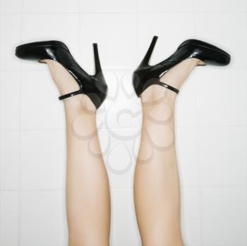 Royalty Free Photo of Female Legs Sticking Up in the Air With High Heels Turned Out
