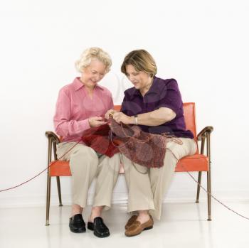 Royalty Free Photo of Older Women Sitting Knitting