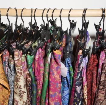 Royalty Free Photo of Colorful Clothes Hanging on a Rack
