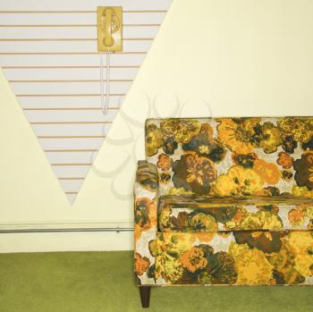 Royalty Free Photo of a Retro Floral Printed Sofa