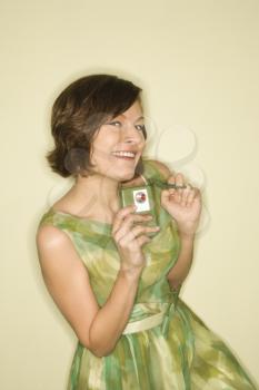 Royalty Free Photo of a Woman Wearing a Retro Dress Smiling