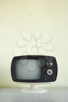 Royalty Free Photo of a Still Life of a Vintage Television Set With Antenna Raised