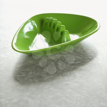 Royalty Free Photo of a Still Life of an Empty Green Plastic Vintage Ashtray