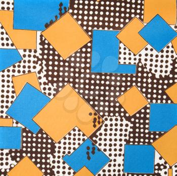 Royalty Free Photo of a Close-up of a Colorful Vintage Fabric With Blue and Yellow Shapes Printed on Polyester