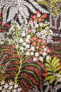 Royalty Free Photo of a Close-up of Vintage Fabric With Flowers Printed on Polyester