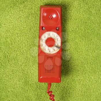 Royalty Free Photo of a Red Vintage Rotary Telephone Receiver