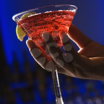 Royalty Free Photo of an African American Man's Hand Holding a Martini Drink
