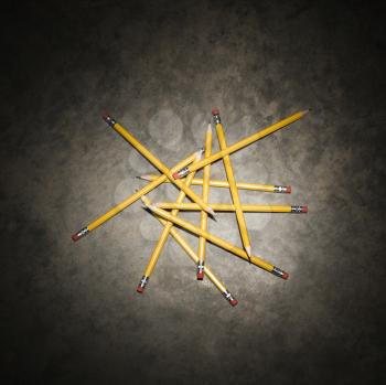 Royalty Free Photo of Pencils in a Pile on a Textured Background