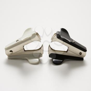 Two staple removers on white background.