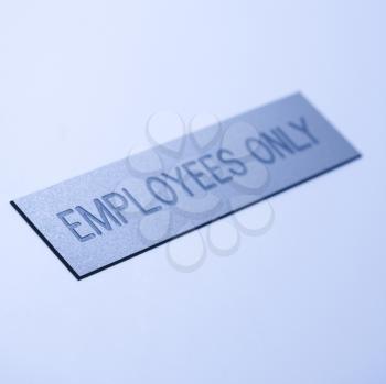 Royalty Free Photo of a Blue Employees Only Sign