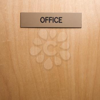 Royalty Free Photo of an Office Sign on a Wooden Door