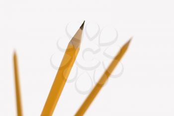 Royalty Free Photo of Three Pencils Pointing in the Air 