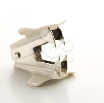 Royalty Free Photo of a Staple Remover on a White Background 