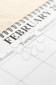 Royalty Free Photo of a Close-up of Spiral Bound Calendar Displaying the Month of February
