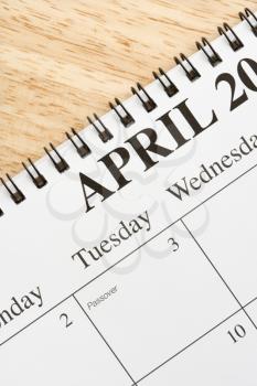 Royalty Free Photo of a Close-up of a Spiral Bound Calendar Displaying the Month of April