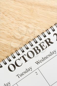 Royalty Free Photo of a Spiral Bound Calendar Displaying the Month of October
