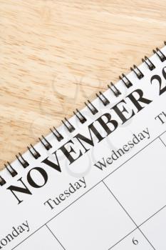 Royalty Free Photo of a Close-up of a Spiral Bound Calendar Displaying the Month of November