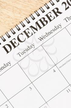 Royalty Free Photo of a Close-up of Spiral Bound Calendar Displaying the Month of December