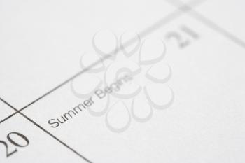 Royalty Free Photo of a Close-up of a Calendar Displaying the Beginning of the Summer