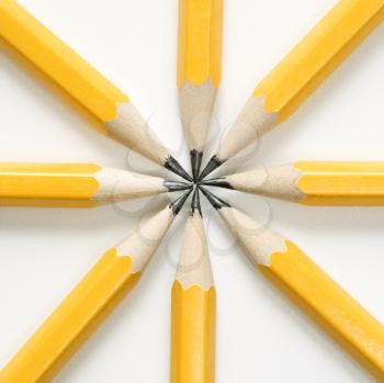 Sharp pencils arranged in a symmetrical radial star shape.