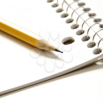 Royalty Free Photo of Sharp Pencil Placed on an Open Spiral Bound Notebook