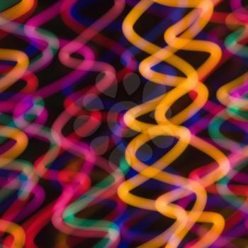 Royalty Free Photo of Multicolored Lights Forming Abstract Squiggle Pattern From Motion Blur