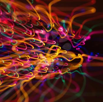 Royalty Free Photo of Multicolored Lights Forming Abstract Squiggle Pattern From a Motion Blur