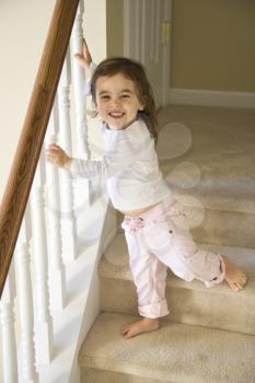 Royalty Free Photo of a Toddler Girl Standing on the Stairs
