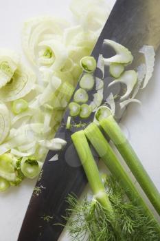 Royalty Free Photo of a Close-up of Chopped Fennel With a Large Kitchen Knife