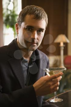 Royalty Free Photo of a Man Holding a Martini