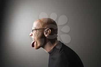 Royalty Free Photo of a Man Sticking Out His Tongue