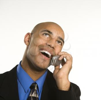 Royalty Free Photo of an African American Man in a Suit Talking on a Cellphone